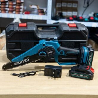 KRTED 8-inch cordless chainsaw 48V kit with two batteries, charger plug, and black hard carrying case on a clean wooden surface.