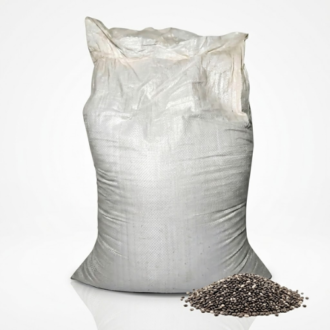 A large, textured white woven polypropylene bulk sack filled with seeds, standing upright on a white surface against a plain wall. The sack is without specific printed labels but features text overlays reading 'OMA XCLUSIVE OILS' and 'POSTED ON JIJI'. This bulk packaging likely contains seeds or raw materials for oil extraction.