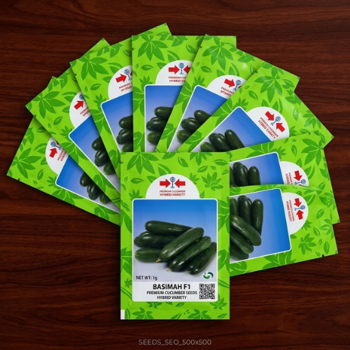 Untitled design (18) Basimah F1 premium hybrid cucumber seeds in green packets displayed on a dark wooden surface.