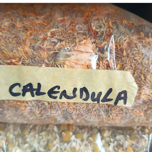 Untitled design (23) Dried calendula flowers in a transparent bag labeled "CALENDULA"