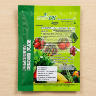 A sealed product packet for 'GreenOK Potassium Humate Plus,' an organic bio-stimulant for all crops, featuring various vegetable illustrations and detailed product information on a light wood background.